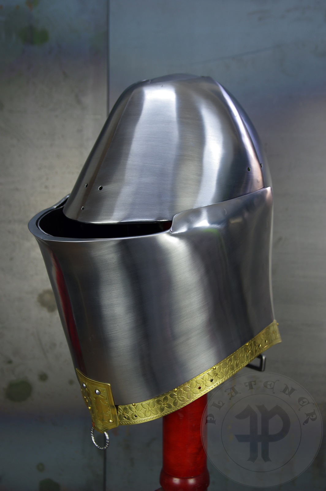 My interpretation of a tournament helm based on the Henry V helm - part of his funeral achievement from Westminster Abbey. It represents an early style of jousting helm dated for 1380-1420. It is composed of five primary plates: rear plate, brown plate, crown plate, face plate and monstrous thick reinforcing plate in front.