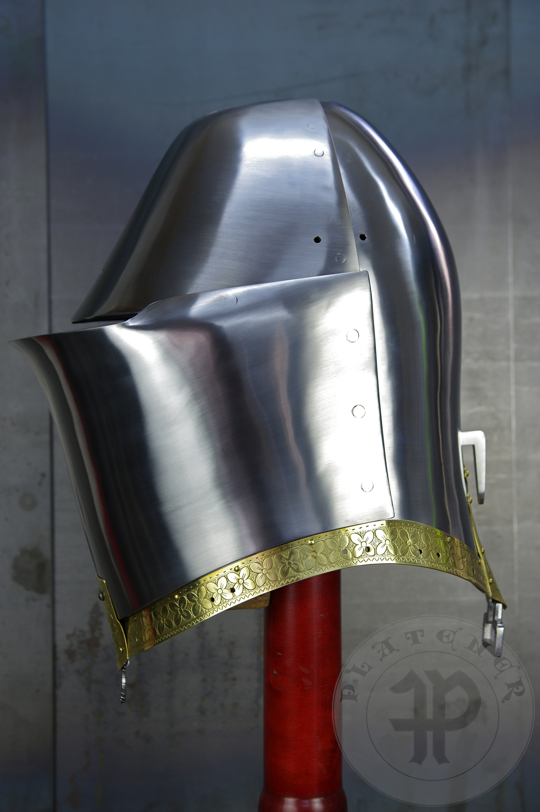 My interpretation of a tournament helm based on the Henry V helm - part of his funeral achievement from Westminster Abbey. It represents an early style of jousting helm dated for 1380-1420. It is composed of five primary plates: rear plate, brown plate, crown plate, face plate and monstrous thick reinforcing plate in front.