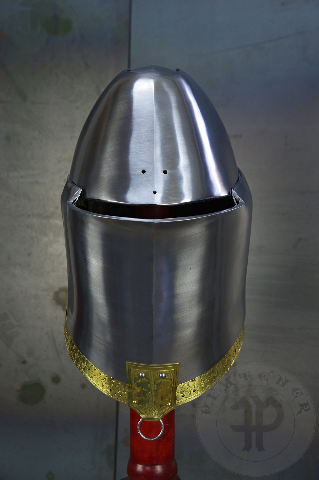 My interpretation of a tournament helm based on the Henry V helm - part of his funeral achievement from Westminster Abbey. It represents an early style of jousting helm dated for 1380-1420. It is composed of five primary plates: rear plate, brown plate, crown plate, face plate and monstrous thick reinforcing plate in front.