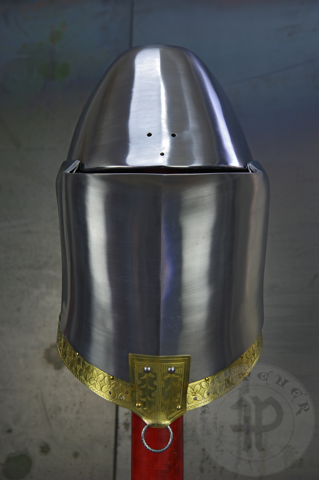 My interpretation of a tournament helm based on the Henry V helm - part of his funeral achievement from Westminster Abbey. It represents an early style of jousting helm dated for 1380-1420. It is composed of five primary plates: rear plate, brown plate, crown plate, face plate and monstrous thick reinforcing plate in front.