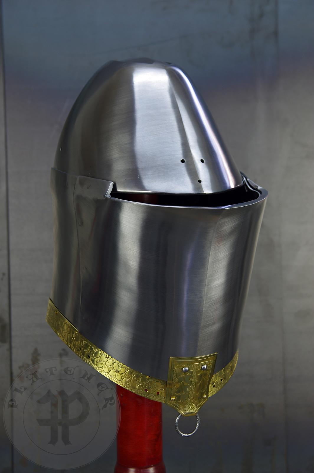 My interpretation of a tournament helm based on the Henry V helm - part of his funeral achievement from Westminster Abbey. It represents an early style of jousting helm dated for 1380-1420. It is composed of five primary plates: rear plate, brown plate, crown plate, face plate and monstrous thick reinforcing plate in front.