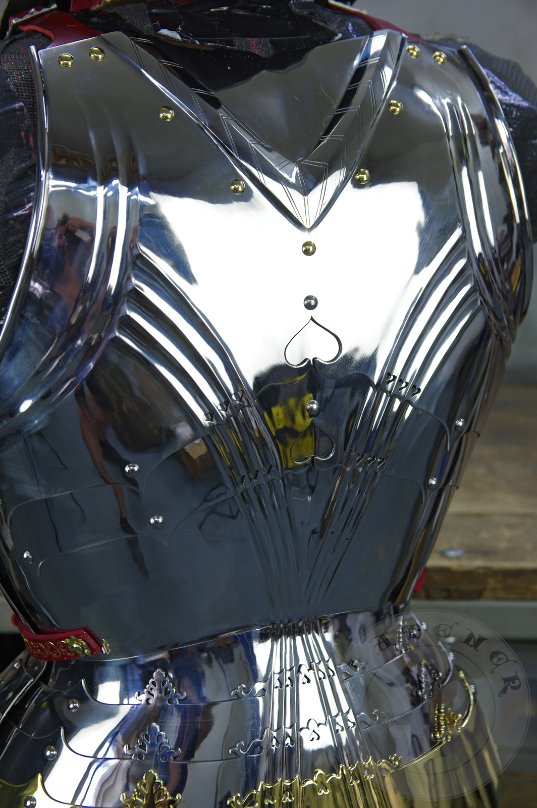 The high gothic set circa 1480-1485 in Helmschmied style consists of sallet, bevor and cuirass. They are made of steel in various thickness: 2 mm; 1,5 mm and 1,2 mm and heat hardened and tempered up to 42 HRC for cuirass with bevor and 38 HRC for sallet. The visor, lower lames and tassets are brass gilded. I also crafted handmade steel buckles for this set. Overall it involved around 850 of work hours to make it.