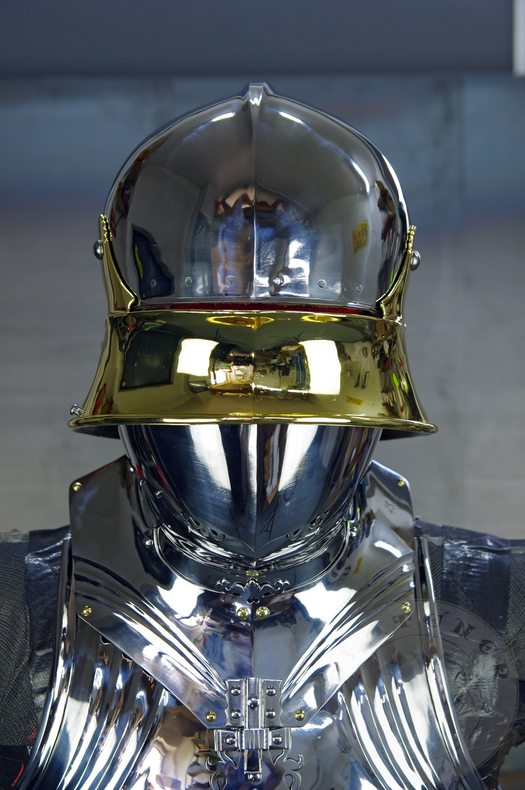 The high gothic set circa 1480-1485 in Helmschmied style consists of sallet, bevor and cuirass. They are made of steel in various thickness: 2 mm; 1,5 mm and 1,2 mm and heat hardened and tempered up to 42 HRC for cuirass with bevor and 38 HRC for sallet. The visor, lower lames and tassets are brass gilded. I also crafted handmade steel buckles for this set. Overall it involved around 850 of work hours to make it.
