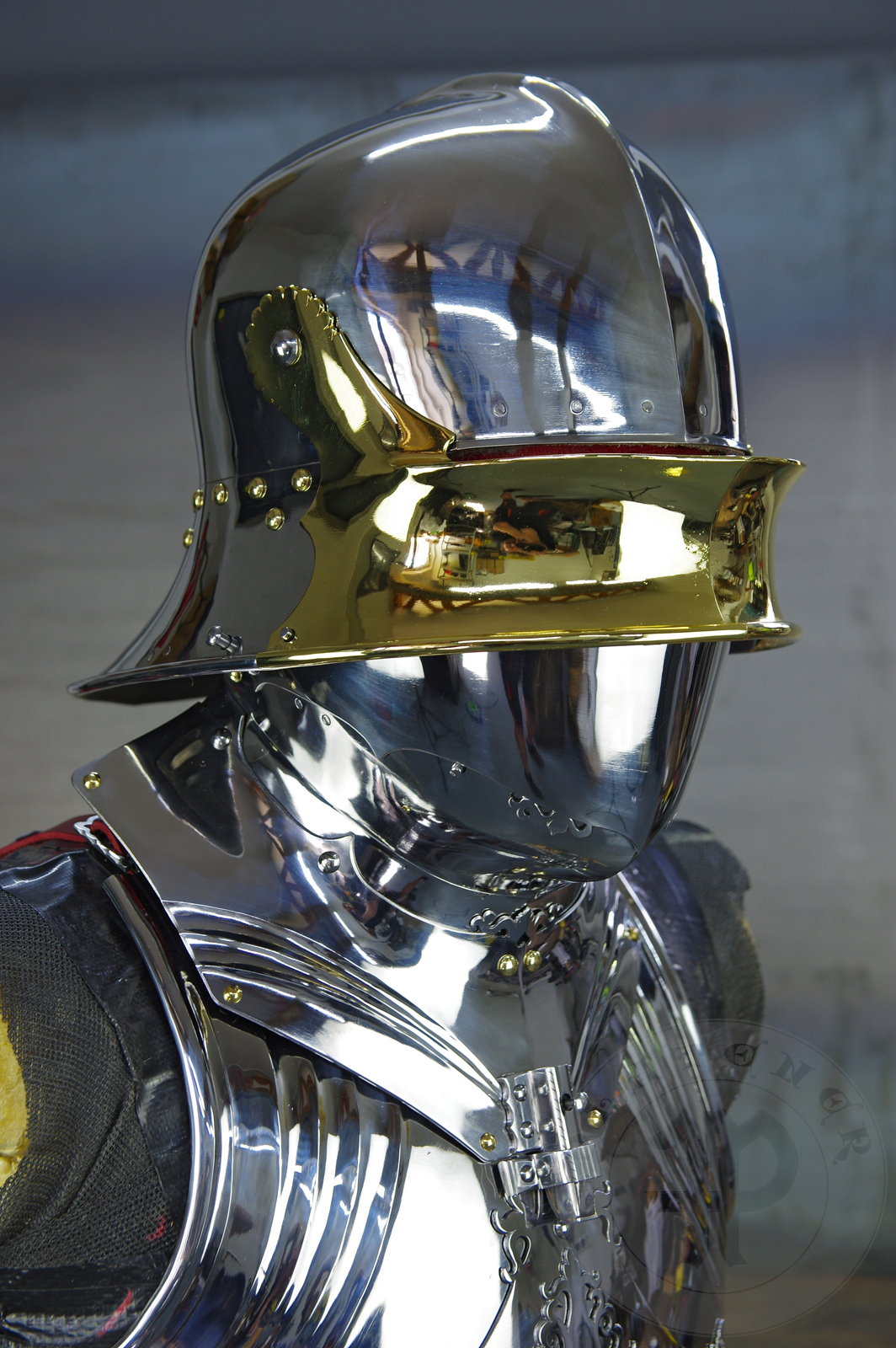 The high gothic set circa 1480-1485 in Helmschmied style consists of sallet, bevor and cuirass. They are made of steel in various thickness: 2 mm; 1,5 mm and 1,2 mm and heat hardened and tempered up to 42 HRC for cuirass with bevor and 38 HRC for sallet. The visor, lower lames and tassets are brass gilded. I also crafted handmade steel buckles for this set. Overall it involved around 850 of work hours to make it.